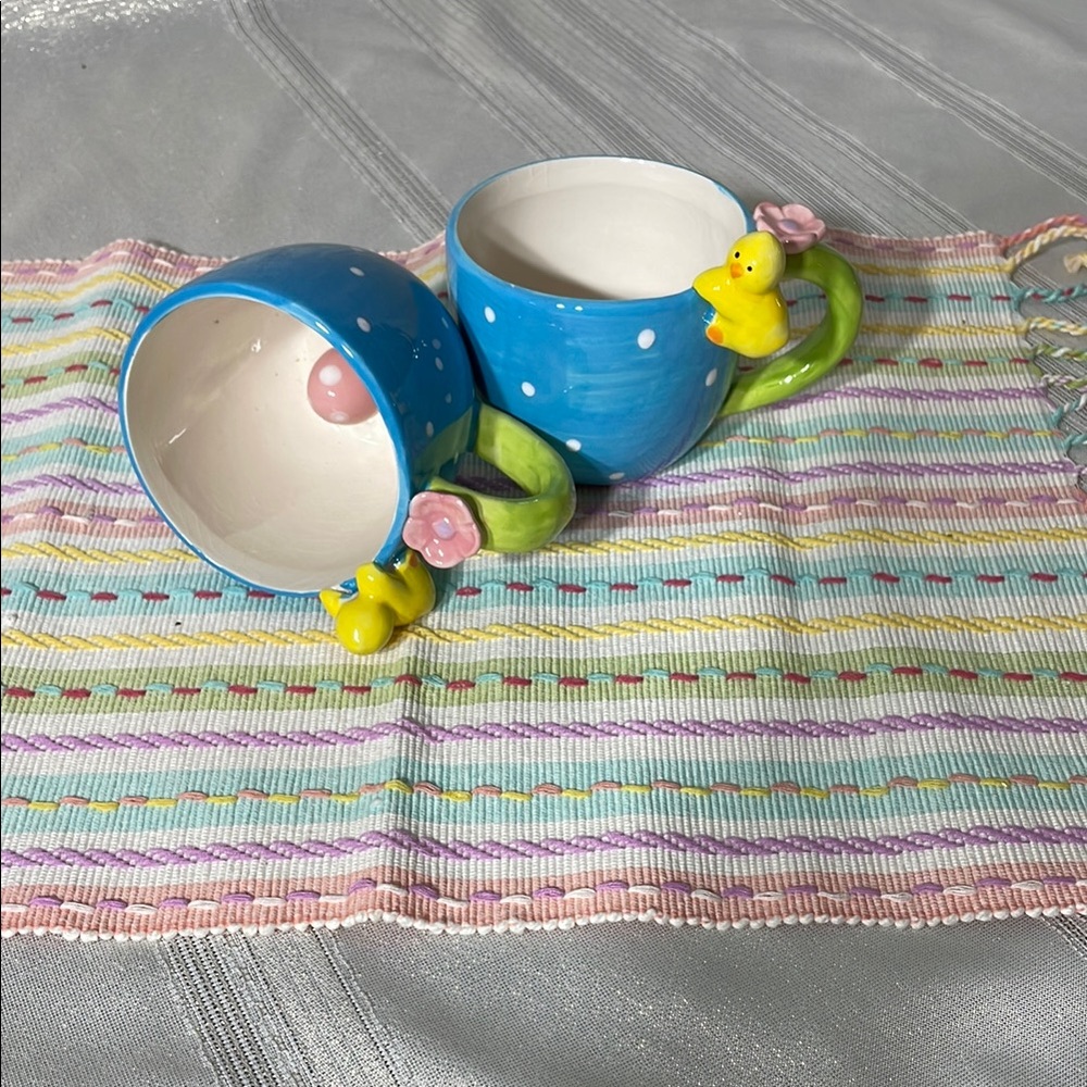 Blue and Green Ceramic Mugs with Floral Accents